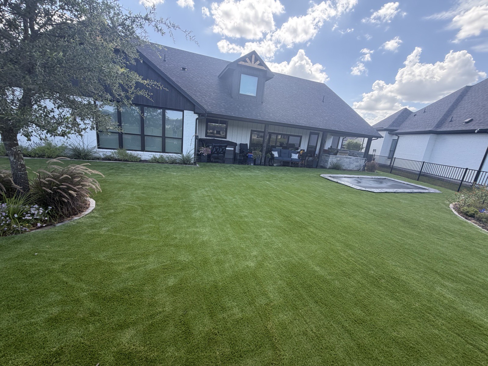 Backyard putting green with four flags